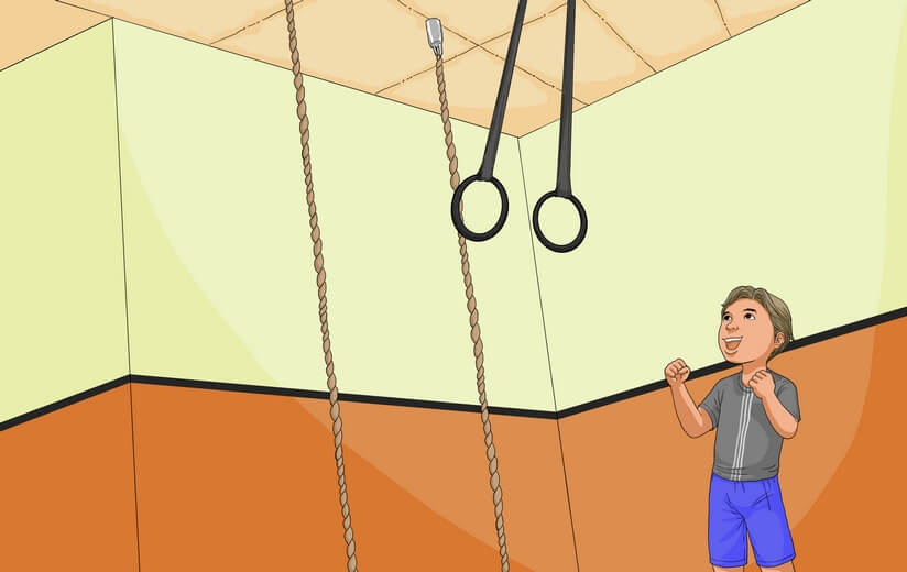 A boy getting ready to perform a rope hang.