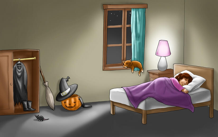 A girl soundly sleeping after a night of trick-or-treating.