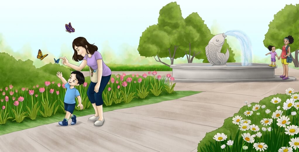 A mother and son observing butterflies in a park, with a water fountain behind them.