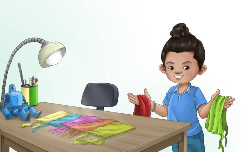 A boy choosing which color of Patka to wear.